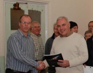 Danny Thomas presenting a prize to Mark Janes